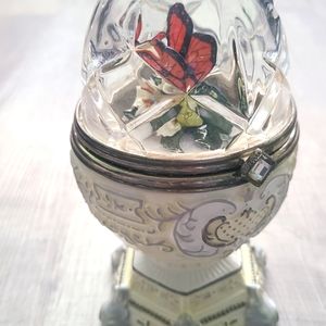 Butterfly crystal and porcelain egg shaped music box.